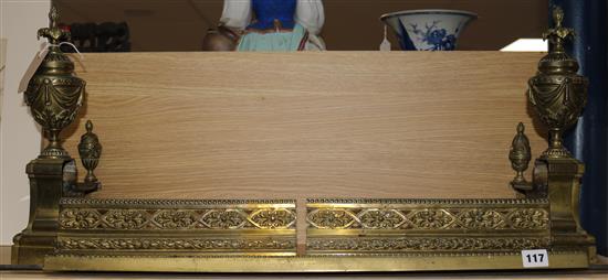 A gilt brass adjustable fender